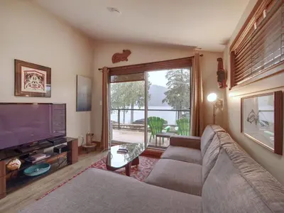a living room with a couch and a television at Tiltin Hilton- Ocean View - Pet Friendly - sleep 4 in Port Renfrew