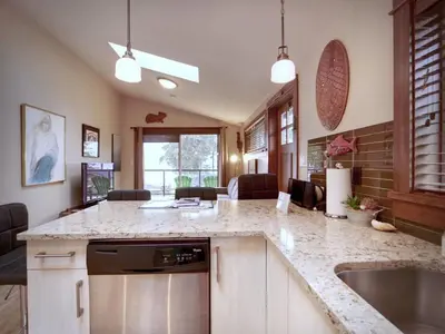 a kitchen with a sink and a counter top at Tiltin Hilton- Ocean View - Pet Friendly - sleep 4 in Port Renfrew