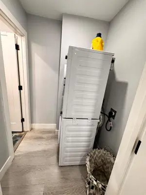 a white cabinet with a yellow object on top of it at Private 1BR Basement Suite in NE Calgary in Calgary