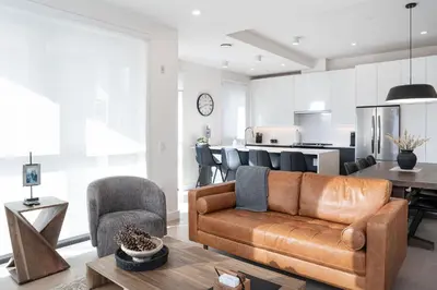 a living room with a couch and a table at The Ridge - 3 Bedroom Condo - Roof Top Hot Tub in Revelstoke