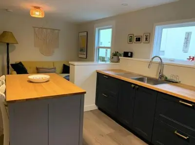 a kitchen with a sink and a counter top at Beautiful Oasis in prime Vancouver BC with 2 bed and patio PLUS Studio available in Vancouver