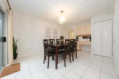 a kitchen and dining room with a table and chairs at Private Room with Full Amenities in Cozy House in Vancouver
