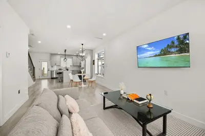 a living room with a couch and a table at Bright Modern 3 Bedroom Suite in Vancouver in Vancouver