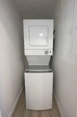 a white washer and dryer in a small kitchen at Condo w 2 Beds 13 Mins from West Edmonton Mall in Edmonton