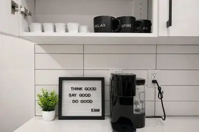 a coffee machine sitting on a counter in a kitchen at Condo w 2 Beds 13 Mins from West Edmonton Mall in Edmonton
