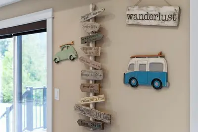 a wall with street signs and a sign for a garage at Spacious Oceanview - 2 living rooms & fridges - Pet Friendly in Port Renfrew