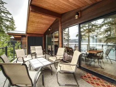 a group of chairs and tables on a patio at Oceanfront view - Pet Friendly - Sleep 8 in Port Renfrew