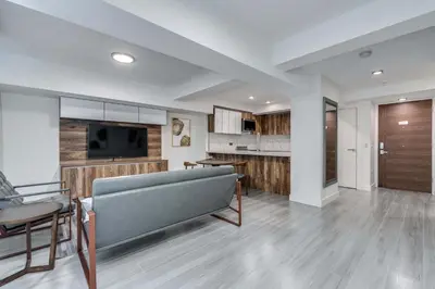 a living room with a couch and a dining room at Prime West End 2BR- Central Vancouver Lifestyle in Vancouver