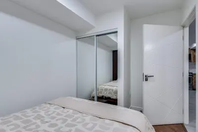 a bedroom with a bed and a sliding glass door at Prime West End 2BR- Central Vancouver Lifestyle in Vancouver