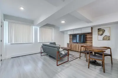 a living room with a couch and a table at Prime West End 2BR- Central Vancouver Lifestyle in Vancouver
