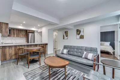 a living room with a couch and a table at Prime West End 2BR- Central Vancouver Lifestyle in Vancouver