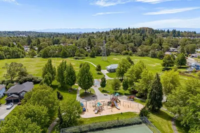 an aerial view of a park with a basketball court at 2 Bedroom 1 Bath On An Oak Tree Lined End Street On The Galloping Goose in Victoria