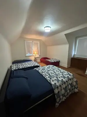 a bedroom with a large bed in a room at Vancouver Budget Stay - Airport 10 Min - Free Parking & Fast WiFi in Vancouver
