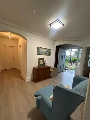 a living room with a couch and a table at Budget Vancouver Stay - Airport & Downtown 10 & 15 Min, Free Parking & Fast Wifi in Vancouver