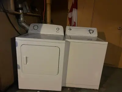 two white appliances sitting on top of each other at Budget Vancouver Stay - Airport & Downtown 10 & 15 Min, Free Parking & Fast Wifi in Vancouver