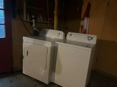 two machines sitting next to each other in a room at Budget Vancouver Stay - Airport & Downtown 10 & 15 Min, Free Parking & Fast Wifi in Vancouver