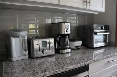 a kitchen with several appliances on a counter at Cozy home in Calgary