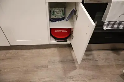 a drawer in a white cabinet with a red bowl at Cozy and Private Guest Suite in West Edmonton in Edmonton