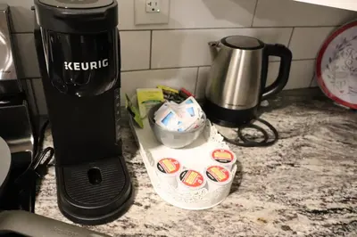 a coffee maker on a counter next to a coffee pot at Cozy and Private Guest Suite in West Edmonton in Edmonton