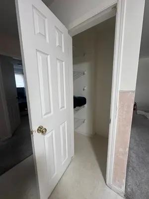 a white door in a room with a closet at 3 Private rooms with built-in closet & desk in Edmonton