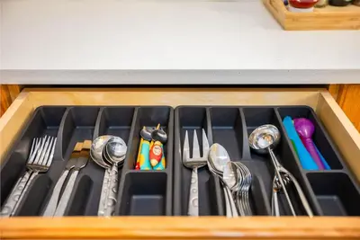 a drawer with forks and spoons and utensils at Central Van 3BR Upper Suite - Near Skytrain in Vancouver