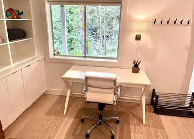 a home office with a desk and a window at Lynn Canyon Forest Retreat in North Vancouver