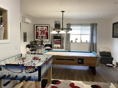 a living room with a pool table in it at The Cozy Nook in Grand Forks