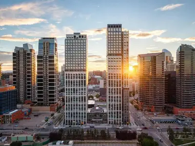 a city skyline with tall buildings in a city at Simple Minimalist Condo For Busy Students or Professionals in Calgary