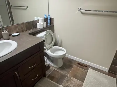 a bathroom with a toilet and a sink at Peace Home in Calgary