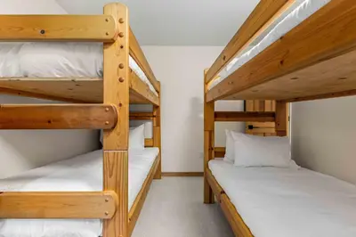 a bedroom with two bunk beds in a room at Glen Eagles by Whistler Premier in Whistler