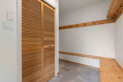 a room with a closet with wooden slats at Glen Eagles by Whistler Premier in Whistler