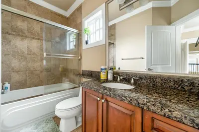a bathroom with a sink and a toilet and a bath tub at Cozy Private Space in Richmond with Modern Comforts in Richmond