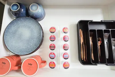 a kitchen counter with a pan and some utensils at Copper Rose Retreat - Mountain B&B in Invermere