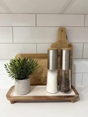 a wooden tray with two salt and a potted plant at Private 2BR Lake Suite - Chestermere - Sleeps 6 in Chestermere