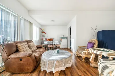 a living room with a couch and a table at Central Vancouver 1BR Close to Transit in Vancouver