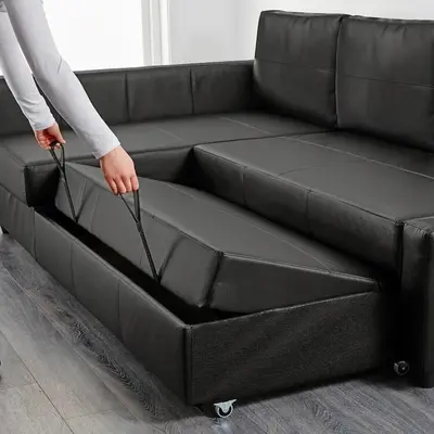 a person is opening a couch with their hands at SixPine - New 2Br Suite in Vancouver