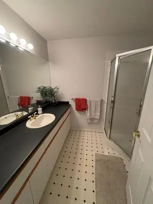 a bathroom with a sink and a shower at Private Room near Scottsdale Shopping Centre in Bélanger