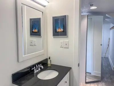a bathroom with a sink and a mirror at Cozy 1 br apartment in Old Town by lake in Yellowknife