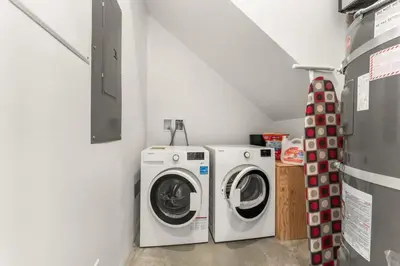 a laundry room with a washer and a dryer at Hot Tub & Amazing Ocean View -The Simple Peak - Non pet friendly in Port Renfrew
