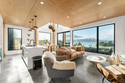 a living room with a couch and a table at Hot Tub & Amazing Ocean View -The Simple Peak - Non pet friendly in Port Renfrew