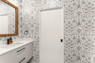 a bathroom with a sink and a mirror at Hot Tub & Amazing Ocean View -The Simple Peak - Non pet friendly in Port Renfrew