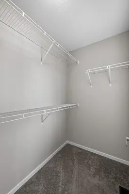 an empty room with shelves on the wall at Family 3BR Suite w Kid's Play Tent, FREE Banff Pass, Netflix! in Calgary