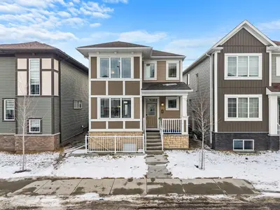 a house and two houses in the snow at Family 3BR Suite w Kid's Play Tent, FREE Banff Pass, Netflix! in Calgary