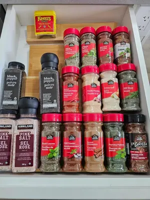 a drawer filled with lots of jars of food at Ultimate Family Retreat Beach, Hot Tub & Games in Windermere