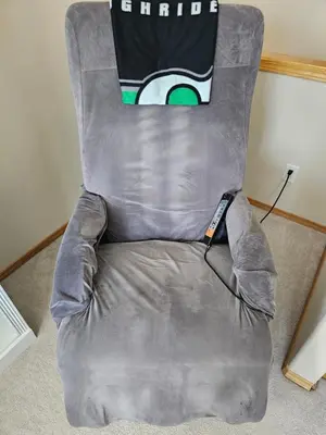 a gray chair with a drink sign on top of it at Family Retreat Hot Tub Banff and Calgary DT Access in Calgary
