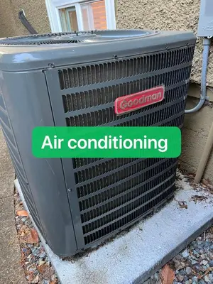 an air conditioner with a sign that reads air conditioning at Dunbar Home in Vancouver