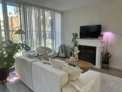 a living room with a couch and a fireplace at Beach House in Vancouver