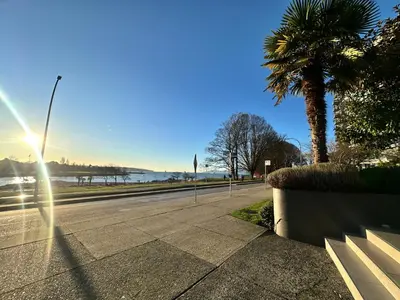 a street with a palm tree on the side of a road at Beach House in Vancouver