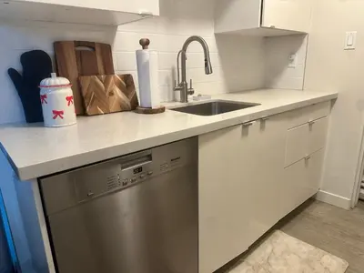 a kitchen with a sink and a dishwasher at Beach House in Vancouver