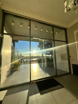 a room with a large window with a view of a building at Beach House in Vancouver